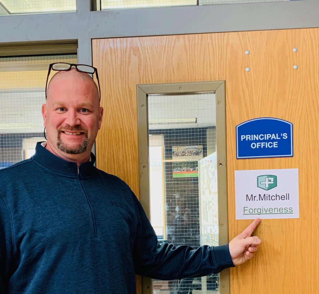 Principal Michael (Mike) Mitchell of Cairo-Durham middle school points to his top Positivity Project character strength: forgiveness.